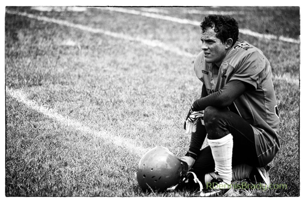 a football player who on the field after losing a game