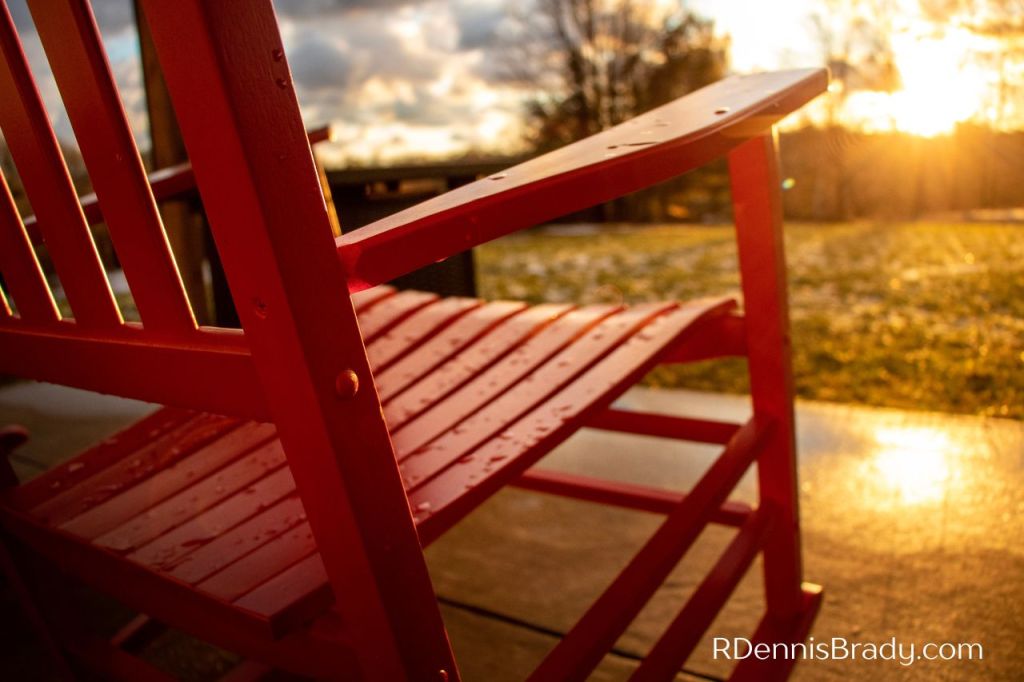 red rocking chair on front porch