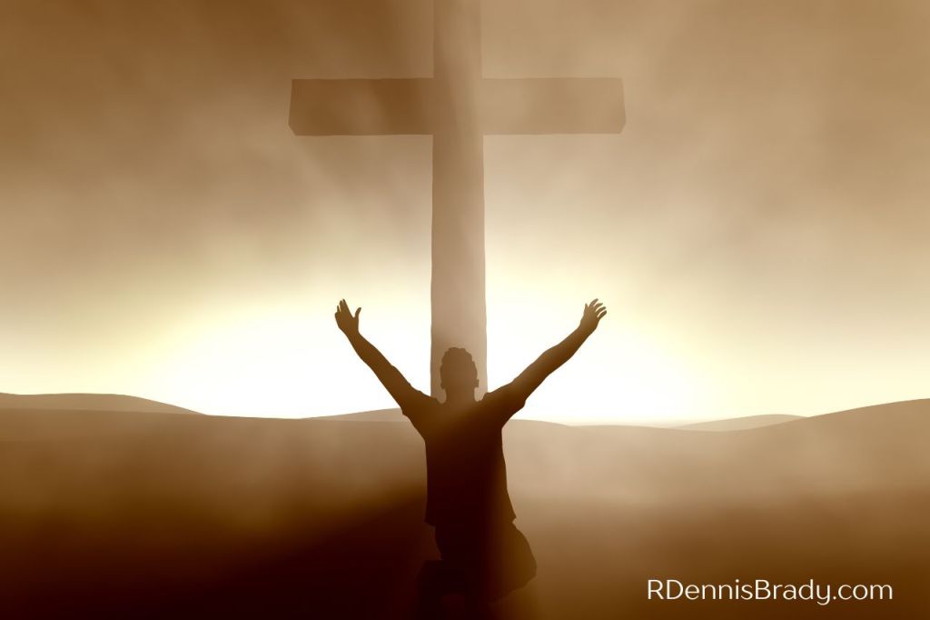 The mind of Christ: man kneeling at foot of Jesus's cross